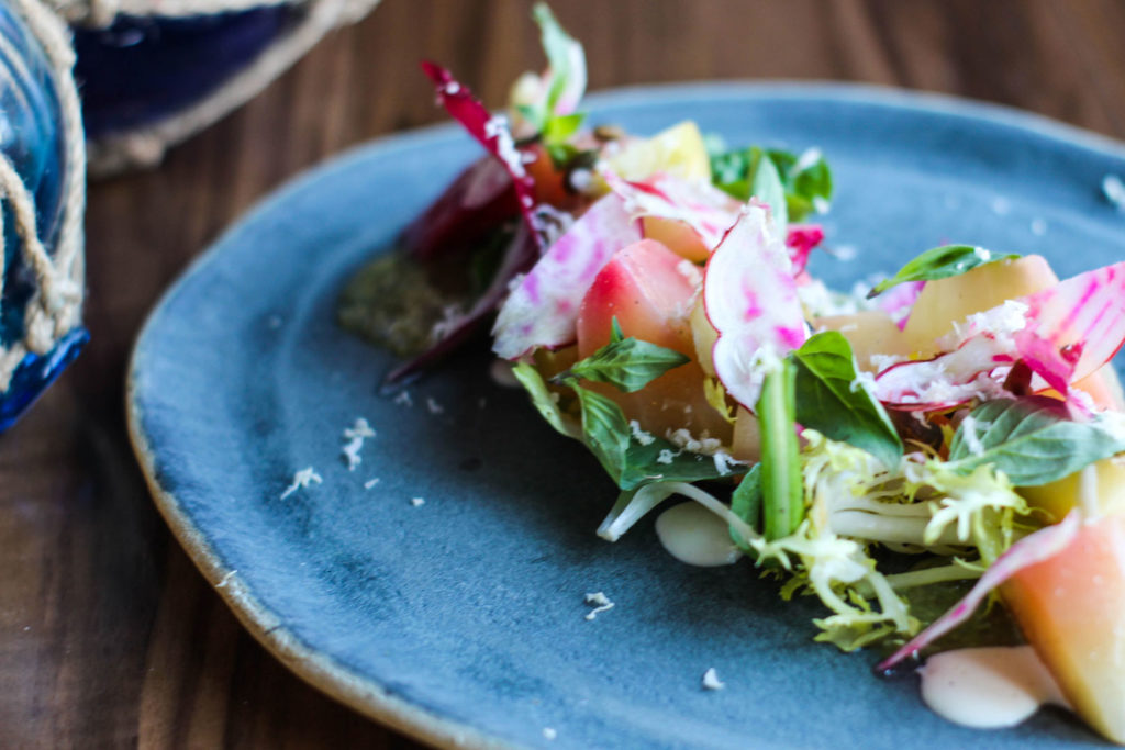 fresh beet salad on blue stoneware plate