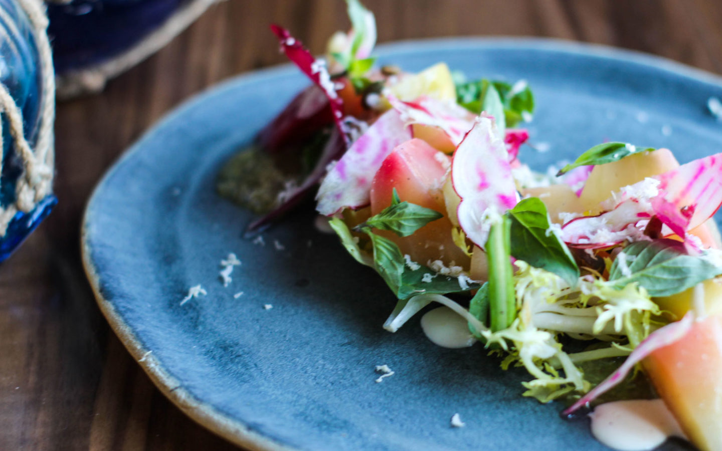 fresh beet salad on blue stoneware plate