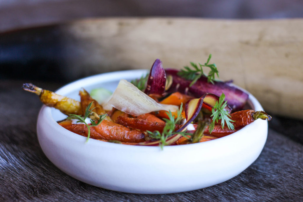 garnished carrot dish in white low rimmed bowl