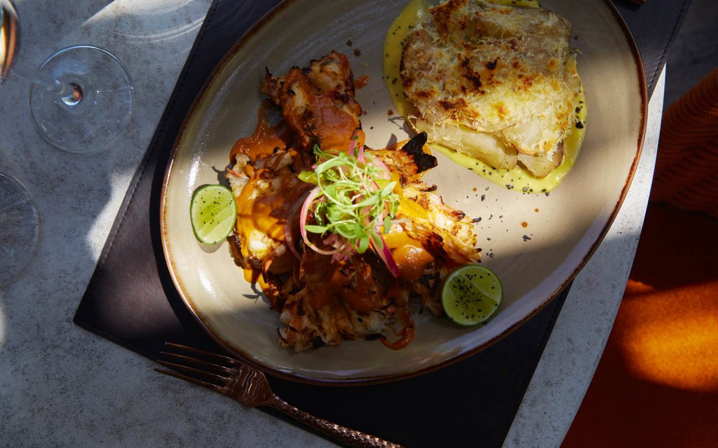 dinner dish with light beam decorated with garnish